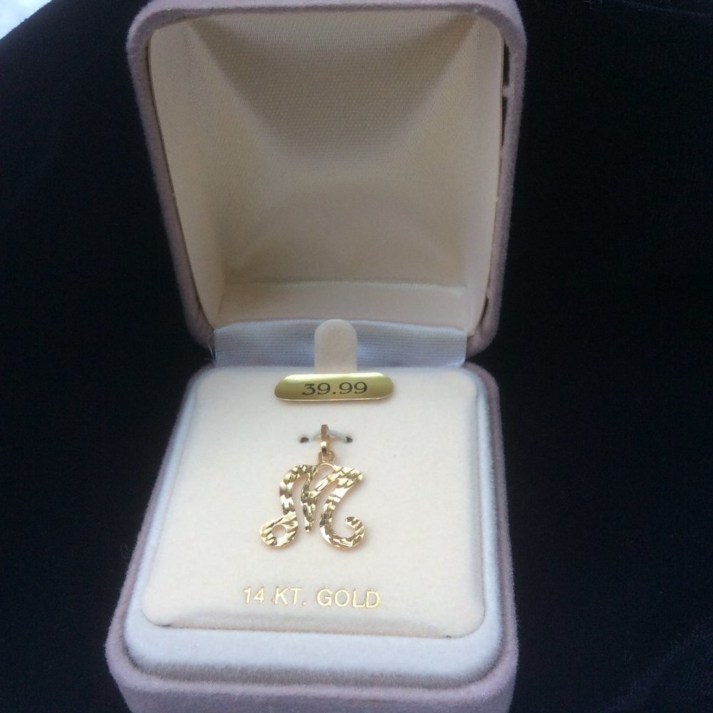 Initial charm "M"